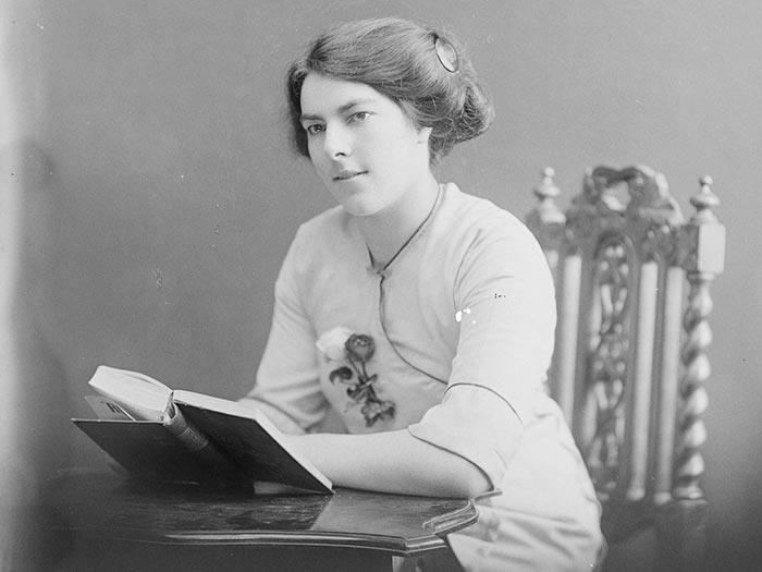 Black and white photograph of a woman reading