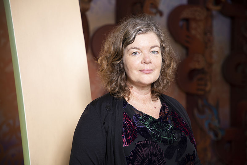 Portrait of Juliet standing in the Marae