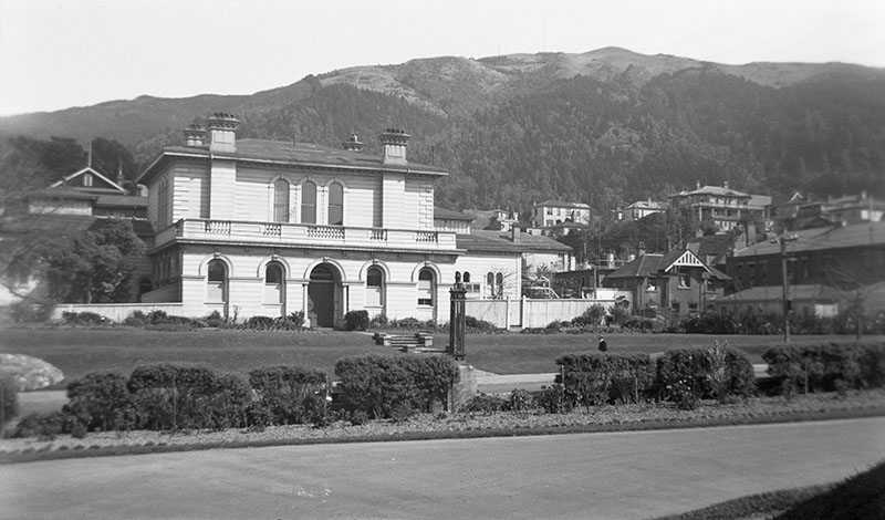 View of two-storey Colonial Museum, with Te Ahumairangi Hill in the background