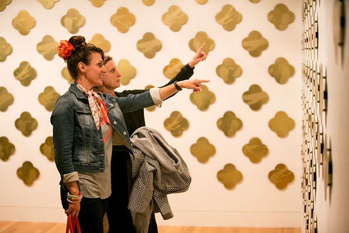 Arts Te Papa visitors looking at The Art of Remembrance. Photo by Michael Hall (c) Te Papa