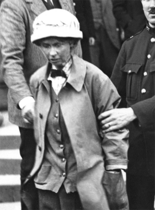 Frances Parker is escorted from Ayr Sheriff Court, Scotland, 1914