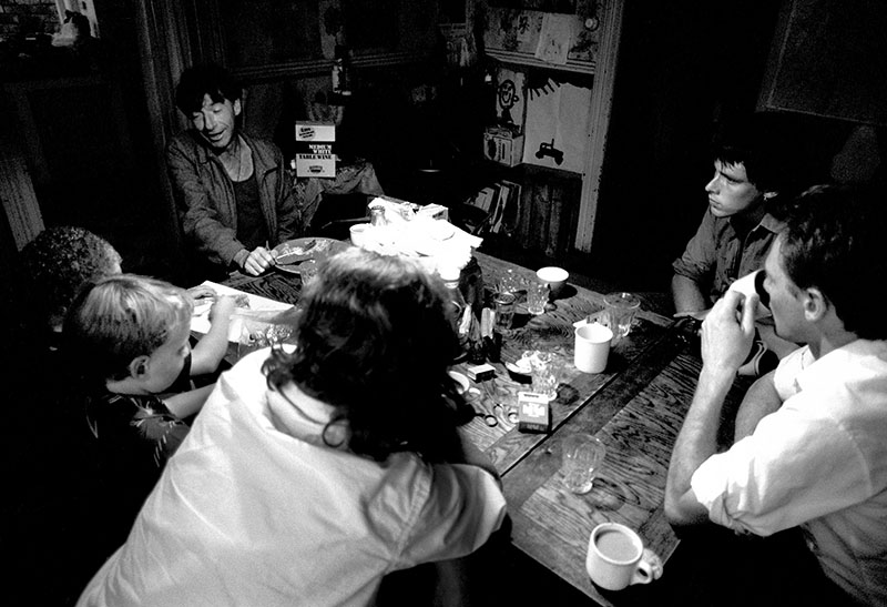 Group of people sit around a table