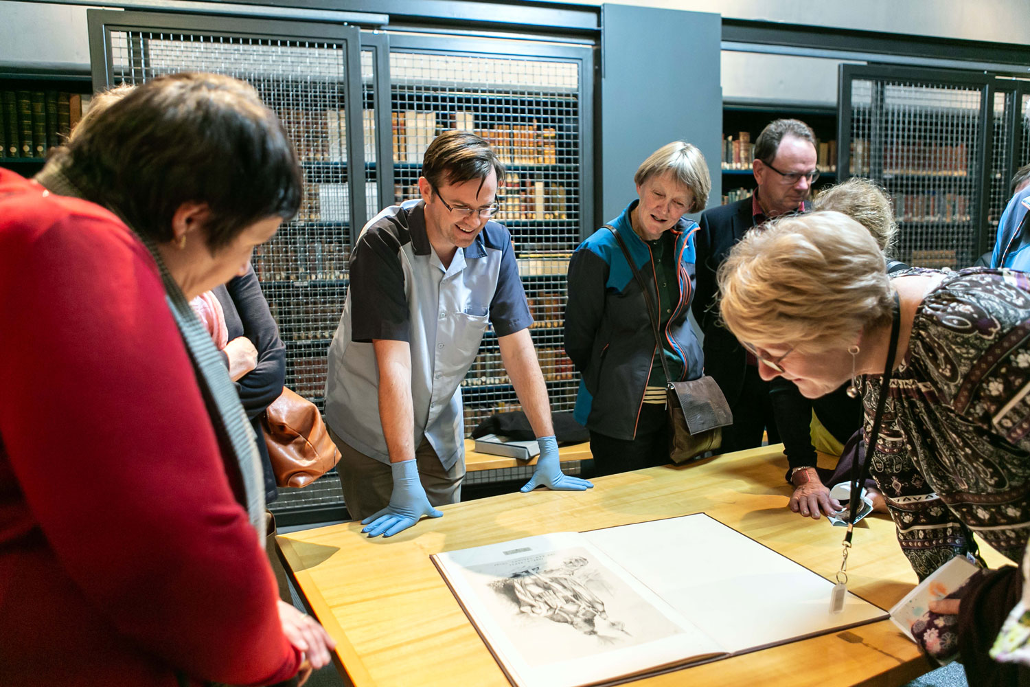 People looking at rare books