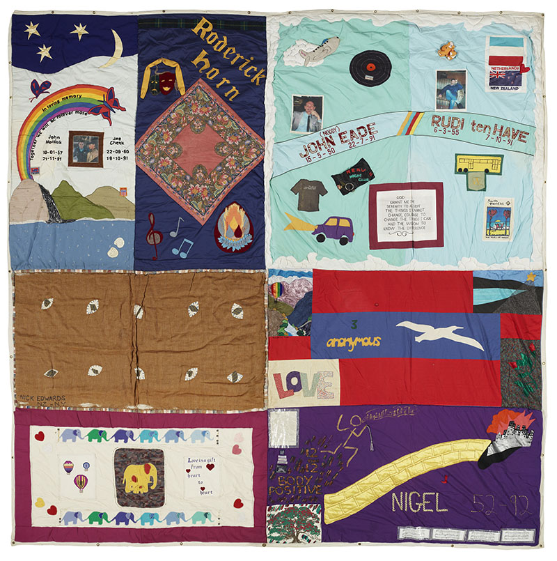 Quilt consisting of 8 vividly coloured panels dedicated to people who died of AIDS. Each panel contains a mixture of words and pictures