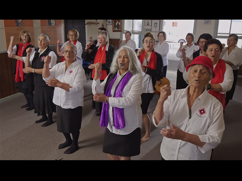 Women in a group dancing with actions