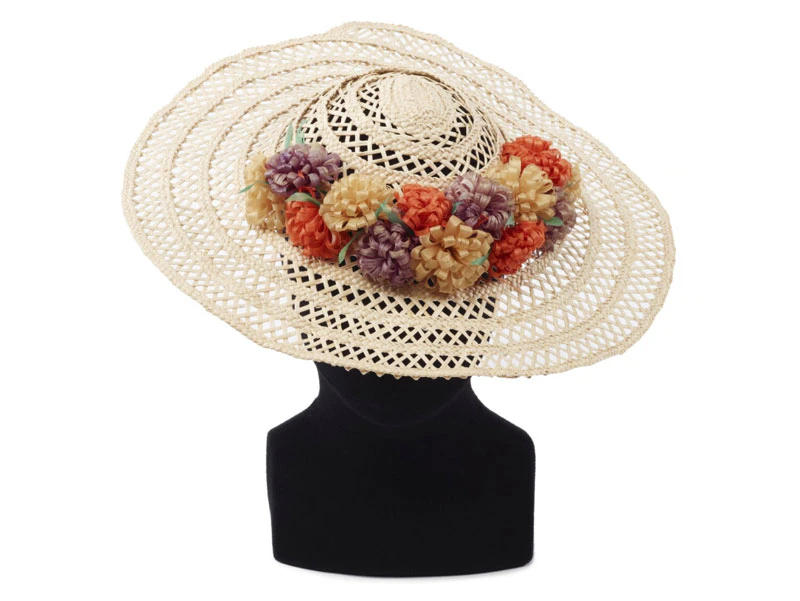 large brimmed woven sun hat with floral decoration