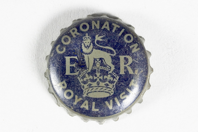 a blue and silver bottle top with the words Coronation Royal Visit and ER in the centre