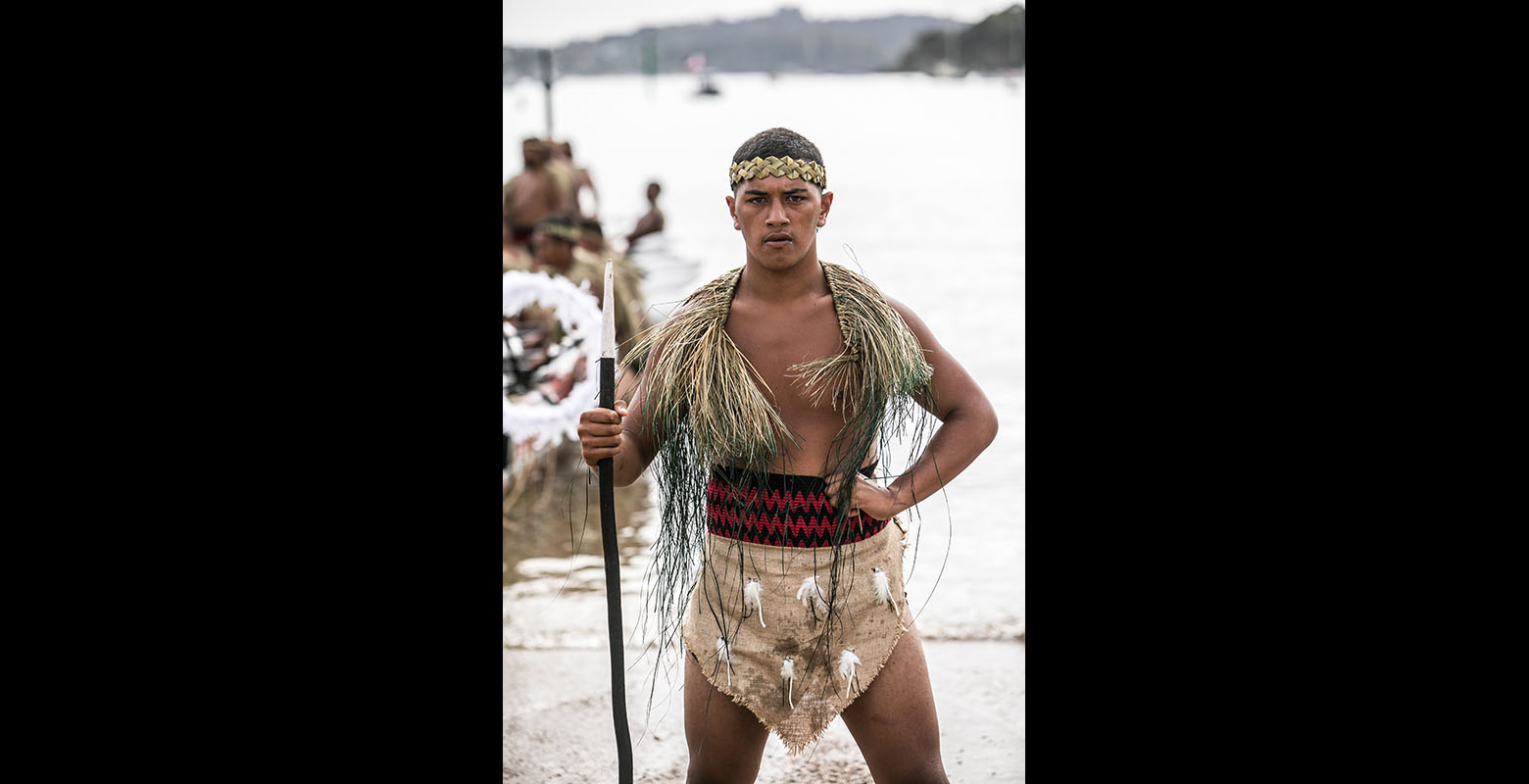 Portrait of a young man holding an oar