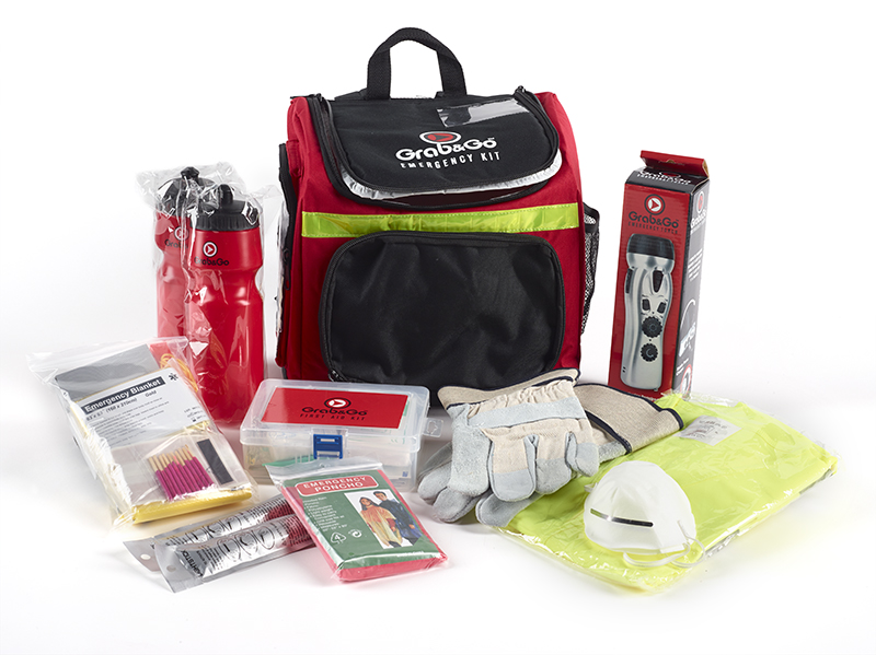 An emergency kit with the contents on display around the bag.