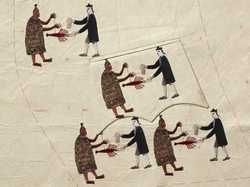 Embroidered image of a Māori man exchanging a crayfish with a white man