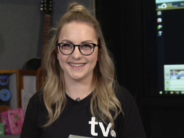 A woman smiling at the camera